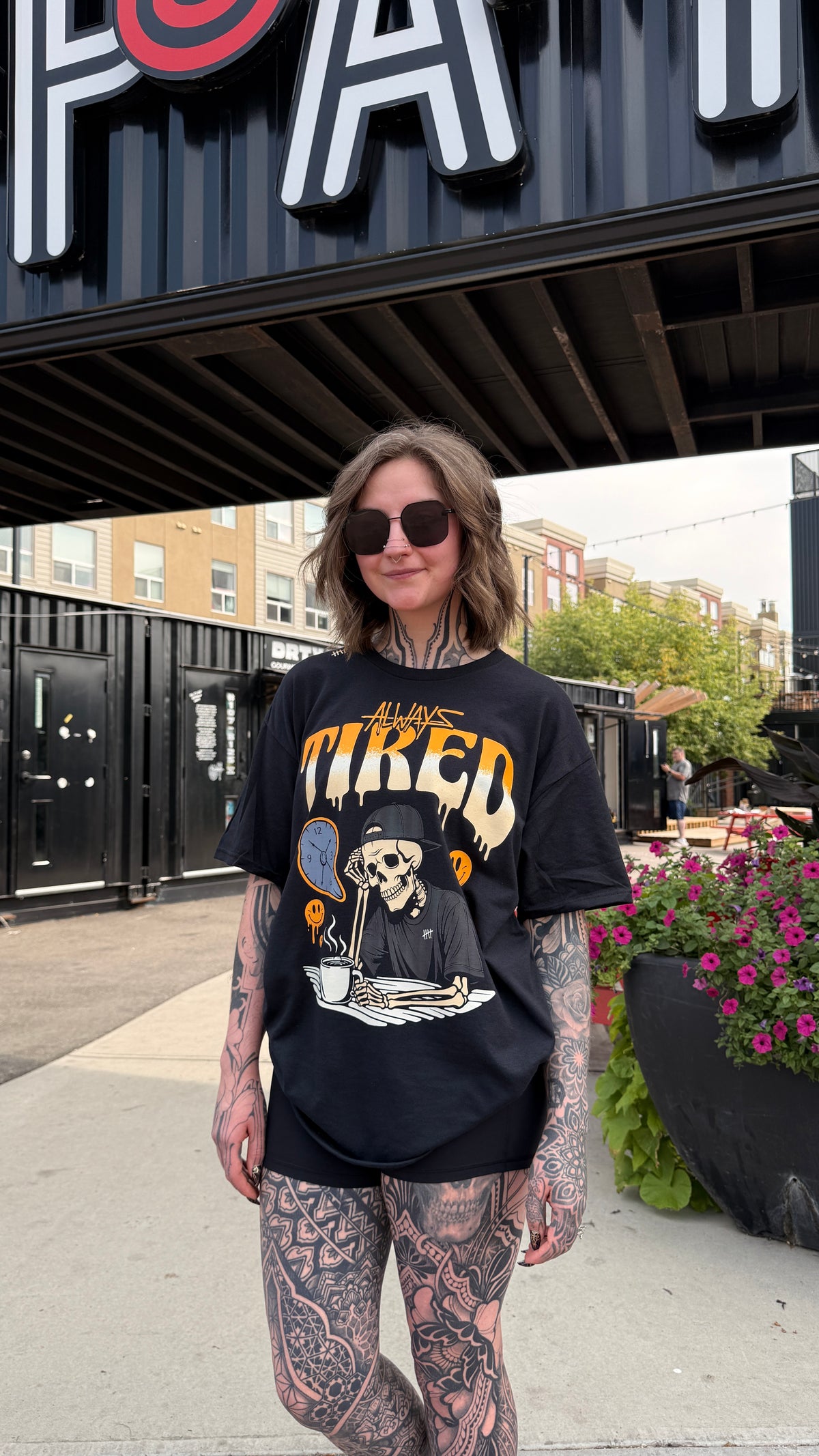 Always Tired 2.0 tattoo-inspired graphic T-shirt lifestyle view by HappyHouse Apparel